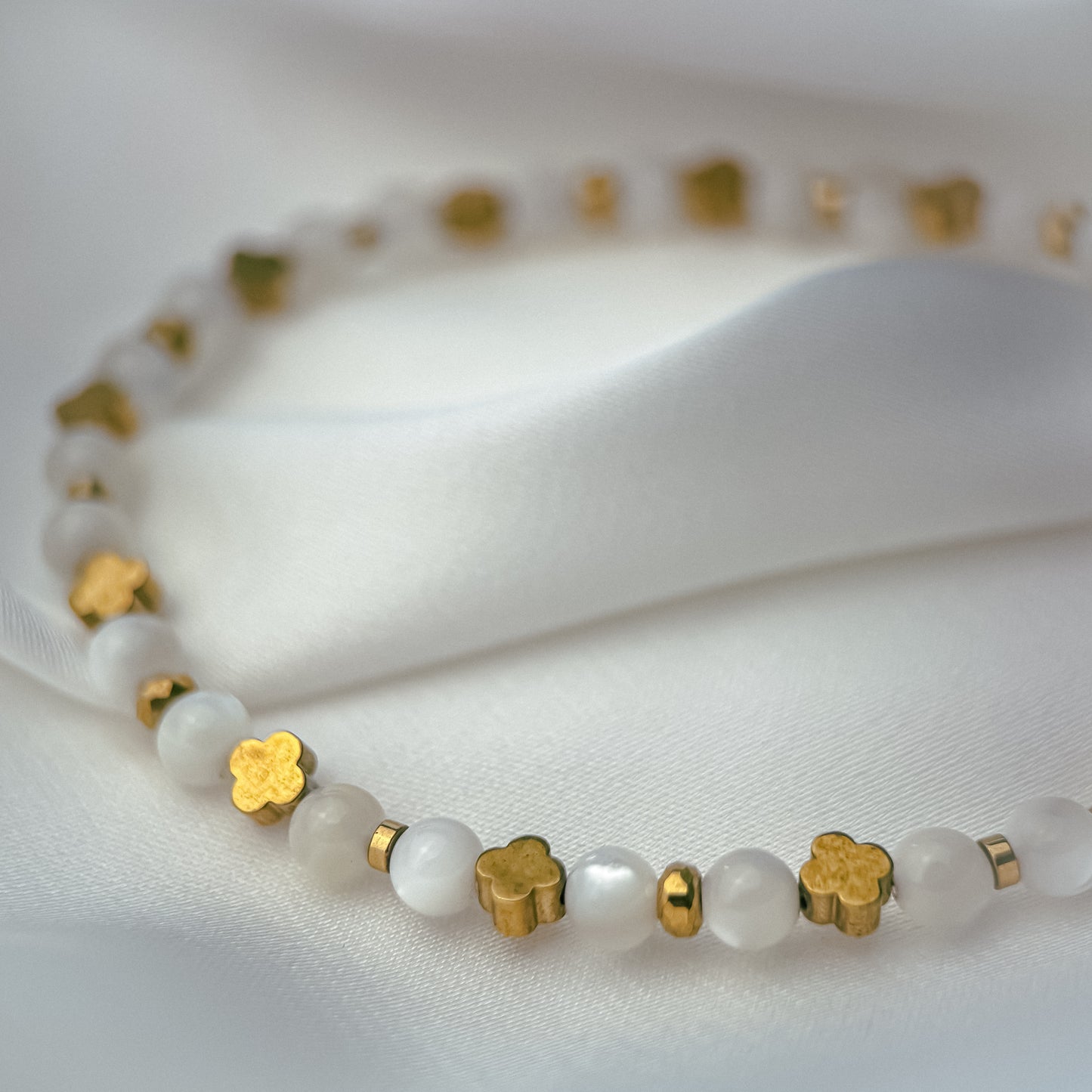 White mother of pearl bracelet.